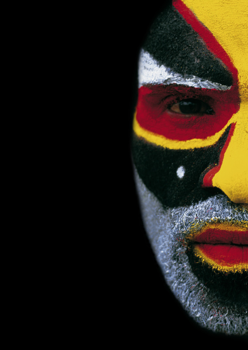 Half face of a highlander warrior during a sing-sing ceremony, Western Highlands Province, Mount Hagen, Papua New Guinea