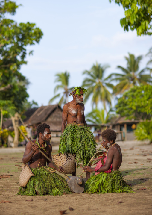 Malagan tatuana masks dance during a funeral ceremony, New Ireland Province, Langania, Papua New Guinea