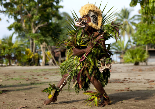 Malagan tatuana masks dance during a funeral ceremony, New Ireland Province, Langania, Papua New Guinea