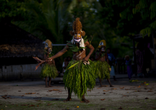 Malagan tatuana masks dance during a funeral ceremony, New Ireland Province, Langania, Papua New Guinea