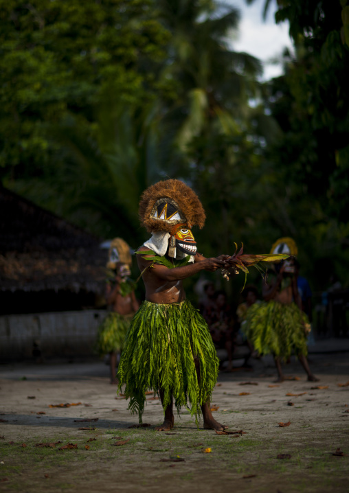 Malagan tatuana masks dance during a funeral ceremony, New Ireland Province, Langania, Papua New Guinea