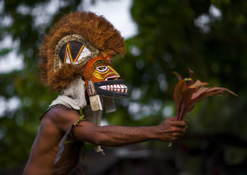 Malagan tatuana masks dance during a funeral ceremony, New Ireland Province, Langania, Papua New Guinea