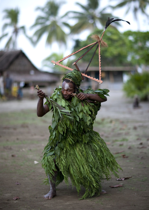 Malagan tatuana masks dance during a funeral ceremony, New Ireland Province, Langania, Papua New Guinea