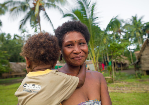 Mother and child, Milne Bay Province, Trobriand Island, Papua New Guinea