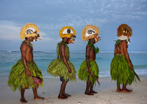 Malagan tatuana masks on a beach, New Ireland Province, Langania, Papua New Guinea