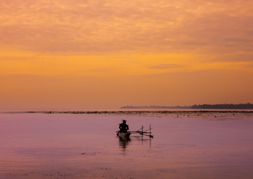 Man on a camoe on the sea, New Ireland Province, Kavieng, Papua New Guinea