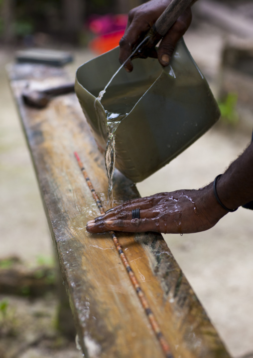 Man making a traditional shell necklaces, New Ireland Province, Kavieng, Papua New Guinea