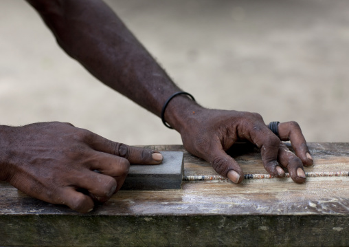 Man making a traditional shell necklaces, New Ireland Province, Kavieng, Papua New Guinea