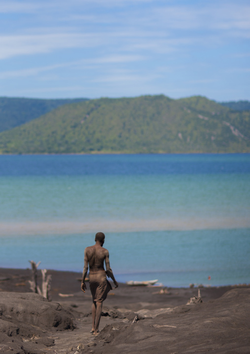 Man digging to find megapode birds eggs in Tavurvur volcano ashes, East New Britain Province, Rabaul, Papua New Guinea