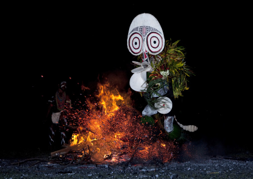 Dancer with a giant mask during a Baining tribe fire ceremony, East New Britain Province, Rabaul, Papua New Guinea