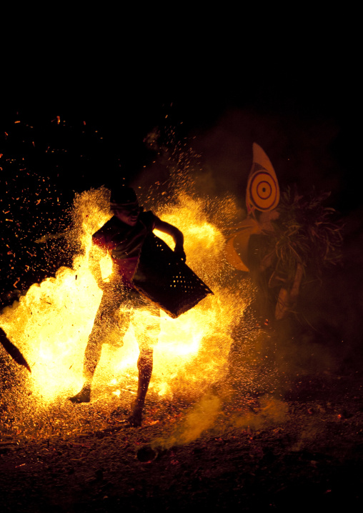 Dancer with a giant mask during a Baining tribe fire ceremony, East New Britain Province, Rabaul, Papua New Guinea