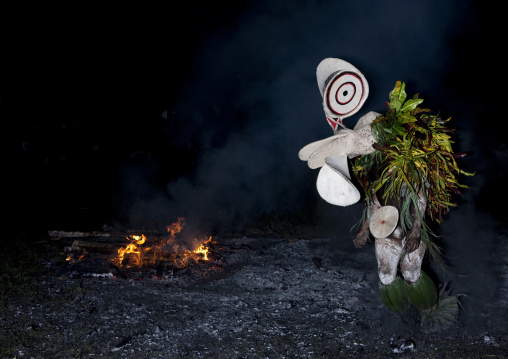 Dancer with a giant mask during a Baining tribe fire dance, East New Britain Province, Rabaul, Papua New Guinea