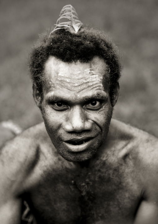 Portrait of man with a leaf in the hair, East New Britain Province, Rabaul, Papua New Guinea