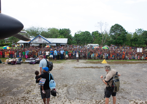 Tourists arriving in airport, Milne Bay Province, Trobriand Island, Papua New Guinea