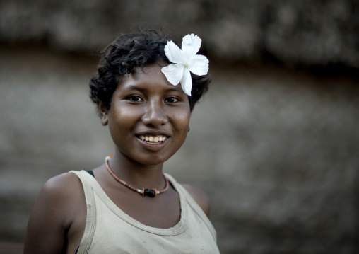 Smiling girl with flowers in the hair, Milne Bay Province, Trobriand Island, Papua New Guinea