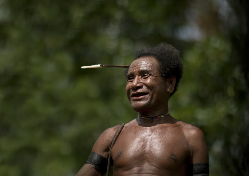 Traditional chief with a betel smile, Milne Bay Province, Trobriand Island, Papua New Guinea