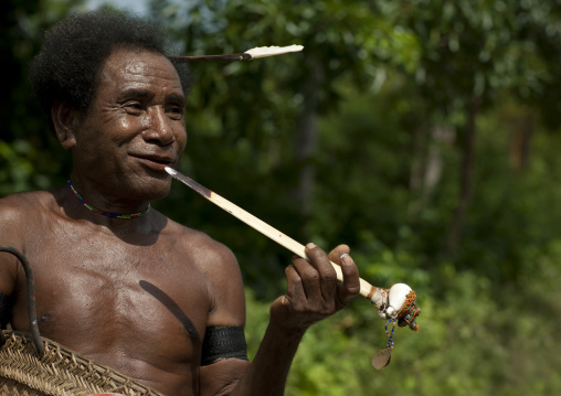 Traditional chief with a betel smile, Milne Bay Province, Trobriand Island, Papua New Guinea