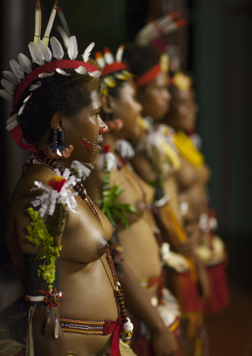 Portrait of topless tribal women in traditional clothing, Milne Bay Province, Trobriand Island, Papua New Guinea