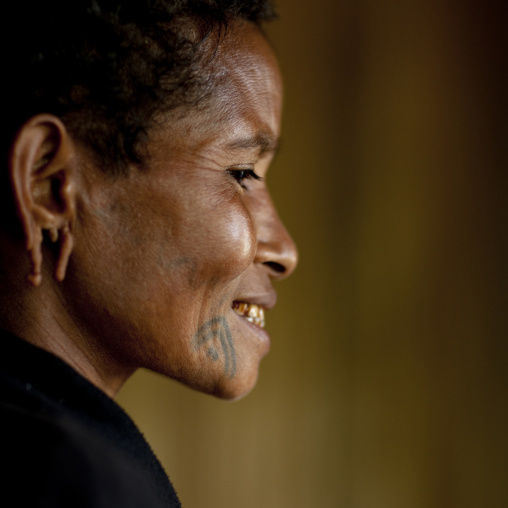 Woman with tattoos on the face, Milne Bay Province, Trobriand Island, Papua New Guinea