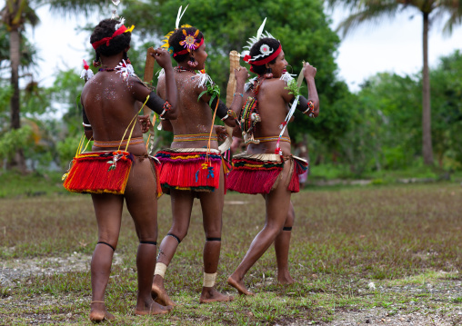 Portrait of topless tribal women in traditional clothing, Milne Bay Province, Trobriand Island, Papua New Guinea