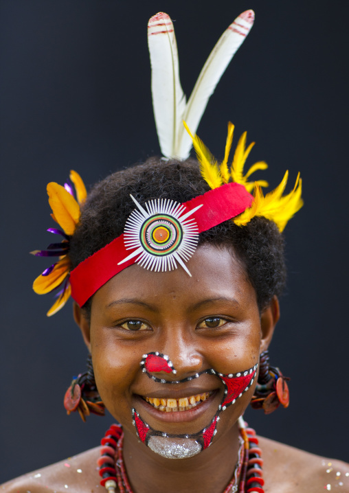 Portrait of a smiling tribal woman in traditional clothing, Milne Bay Province, Trobriand Island, Papua New Guinea