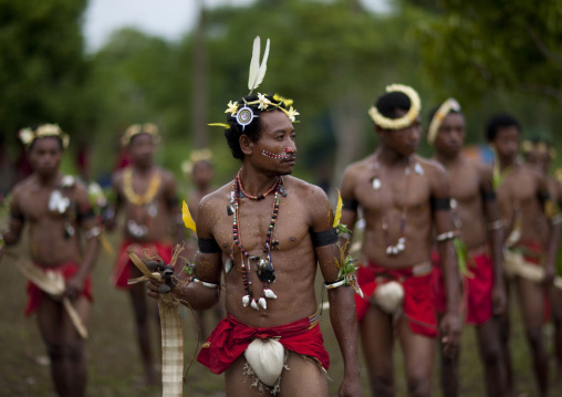 Tribal dancers in traditional clothing during a sing-sing, Milne Bay Province, Trobriand Island, Papua New Guinea