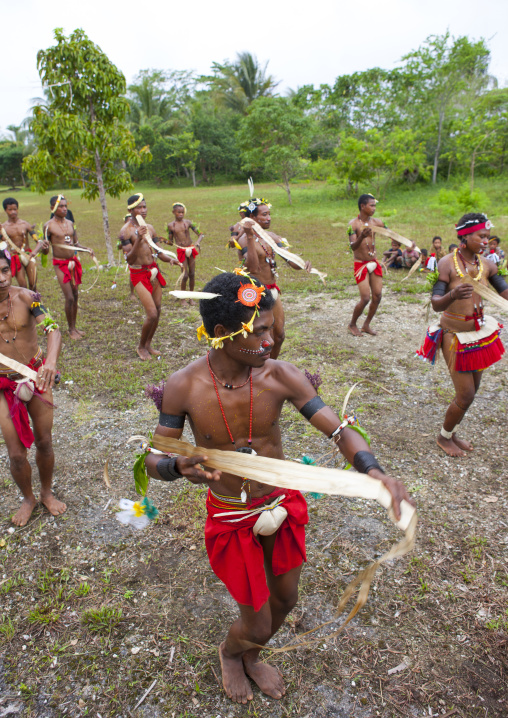 Tribal dancers in traditional clothing during a sing-sing, Milne Bay Province, Trobriand Island, Papua New Guinea