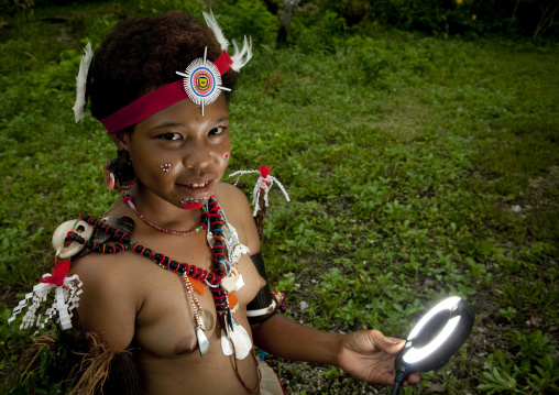 Portrait of a topless tribal woman in traditional clothing, Milne Bay Province, Trobriand Island, Papua New Guinea