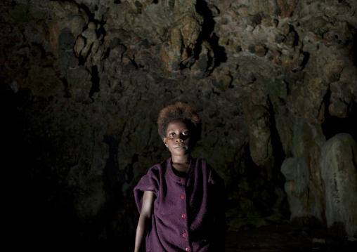 Girl inside momuni sacred cave, Autonomous Region of Bougainville, Bougainville, Papua New Guinea