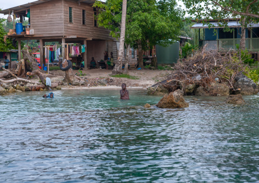 Protection against rising sea levels in a costal village, Autonomous Region of Bougainville, Bougainville, Papua New Guinea