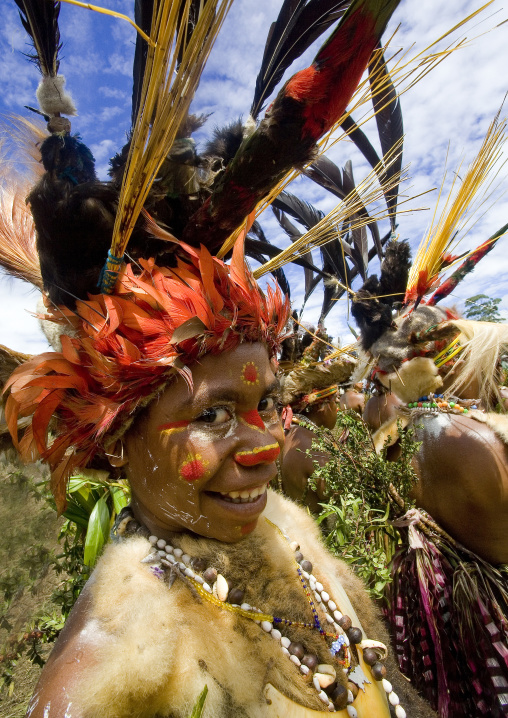 Portrait of a Chimbu tribe woman with headdress made of feathers during a Sing-sing, Western Highlands Province, Mount Hagen, Papua New Guinea