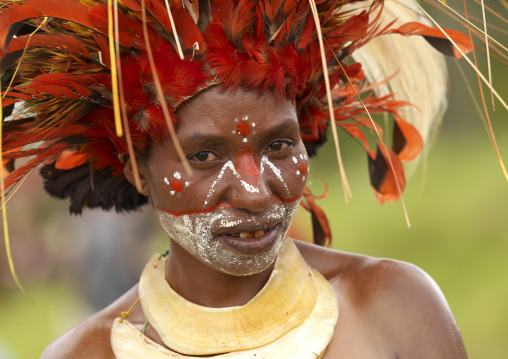 Portrait of a Chimbu tribe woman with headdress made of feathers during a Sing-sing, Western Highlands Province, Mount Hagen, Papua New Guinea