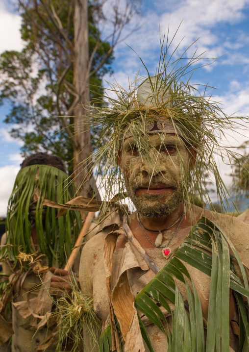 Portrait of a Chimbu tribe man with vegetal headwear during a sing sing, Western Highlands Province, Mount Hagen, Papua New Guinea