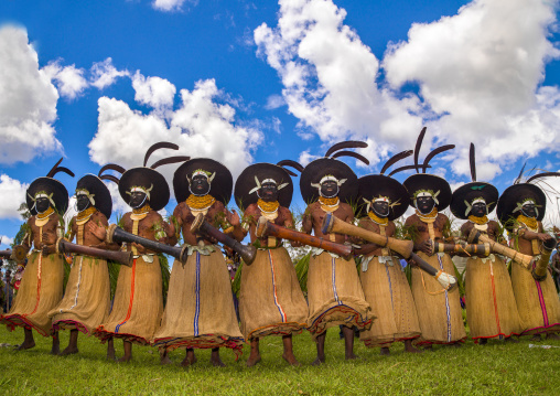 Enga kompian suli muli wigmen dancing in line during a Sing-sing, Western Highlands Province, Mount Hagen, Papua New Guinea