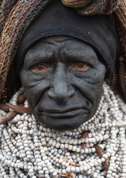 Portrait of a mourning woman with job tears necklaces, Western Highlands Province, Mount Hagen, Papua New Guinea