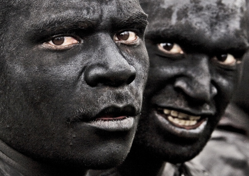 Flying flies men during Sing-sing, Western Highlands Province, Mount Hagen, Papua New Guinea