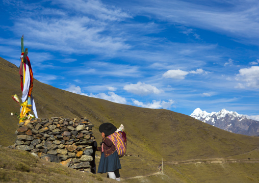 Pilgrim Praying In Front Of One Of The Cross On The Way To Qoyllur Riti Festival, Ocongate Cuzco, Peru