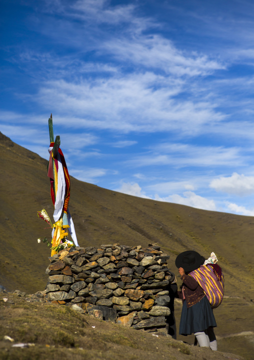 Pilgrim Praying In Front Of One Of The Cross On The Way To Qoyllur Riti Festival, Ocongate Cuzco, Peru