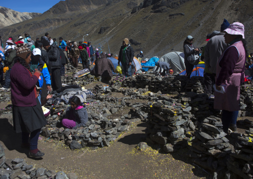 Family By Small Stone Houses And Plots Of Land After Challa, Qoyllur Riti Festival, Ocongate Cuzco, Peru