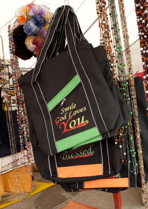 Bags with religious logo for sale in the market, Lake Kivu, Gisenye, Rwanda