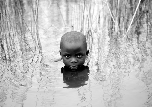 Rwandan boy having a bath, Lake Kivu, Gisenye, Rwanda