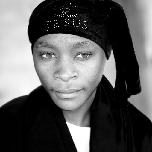 Batwa tribe woman with a jesus headwear, Western Province, Cyamudongo, Rwanda