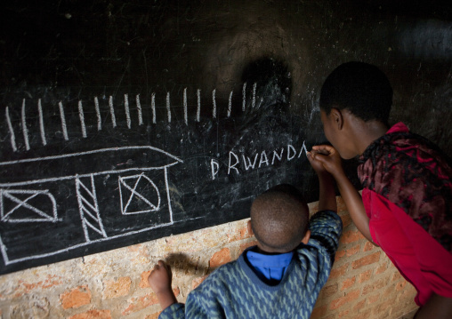 Child with her teacher in a primary school, Nyungwe Forest National Park, Gisakura, Rwanda