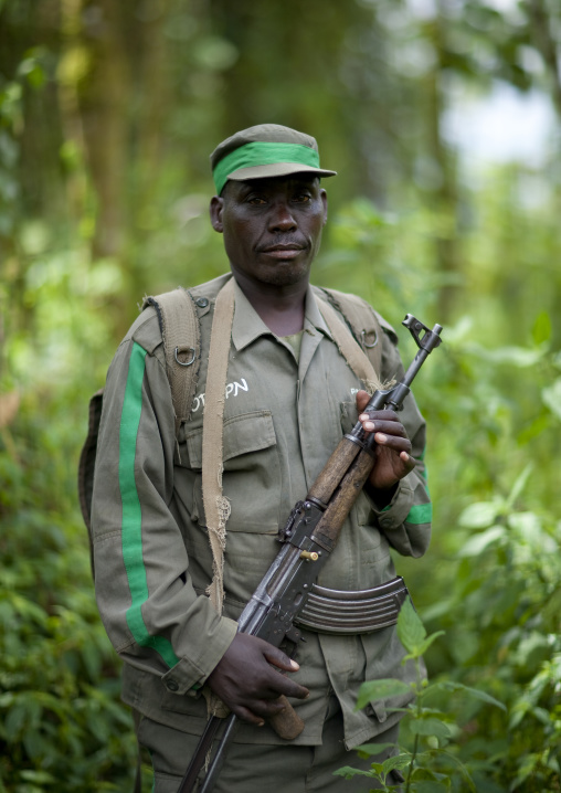 Guide with weapon in volcanoes national park, Northwest Province, Rehengeri, Rwanda