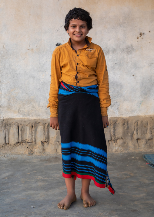 Portrait of a barefoot child wearing futha, Jizan province, Alaydabi, Saudi Arabia