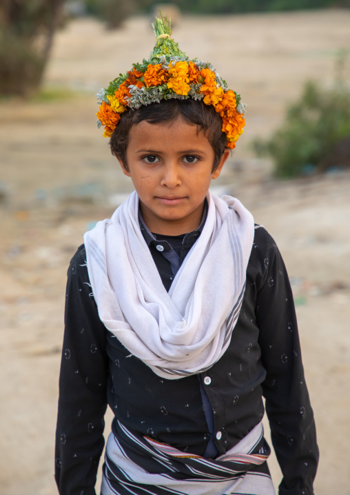 Portrait of a flower boy wearing a floral crown on the head, Jizan province, Alaydabi, Saudi Arabia