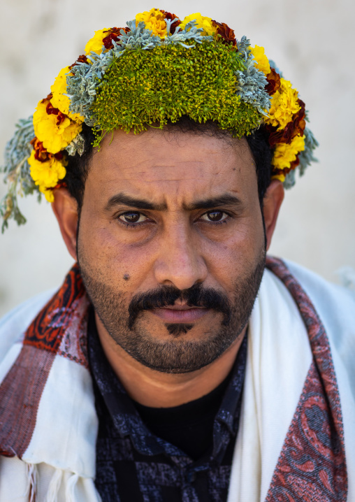 Portrait of a flower man wearing a floral crown on the head, Jizan province, Addayer, Saudi Arabia