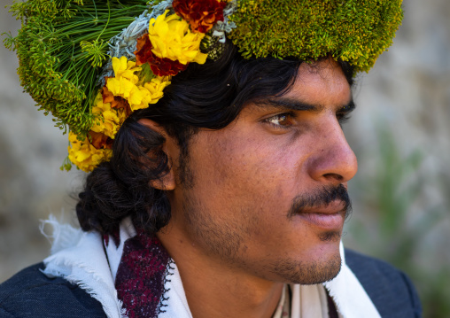 Portrait of a flower man wearing a floral crown on the head, Jizan province, Addayer, Saudi Arabia