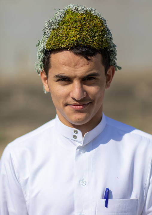 Portrait of a flower man wearing a floral crown on the head, Jizan province, Addayer, Saudi Arabia