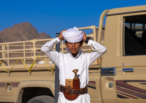 Portrait of a saudi boy wearing a white tradtional clothing, Najran Province, Najran, Saudi Arabia